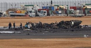 Crews begin clearing plane wreckage from Japan runway collision