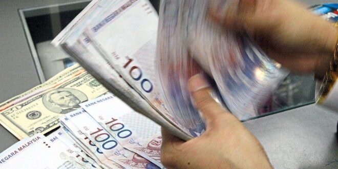 Ringgit opens lower against US as investors await Bank Negara