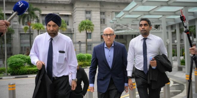 Singapore minister charged with corruption in rare case