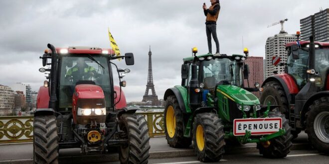 Angry farmers prepare to confront Macron at Paris farm fair