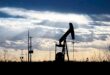 Oil inches down as rising Opec output weigh