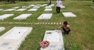 On a Greek island volunteers remake burial site for refugees