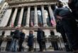 Wall St stocks end higher with major corporate earnings in