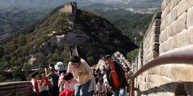 China travel surges for May holiday but consumers remain wary