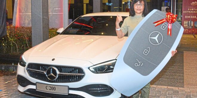 Homebuyer drives away in luxury as group celebrates anniversary