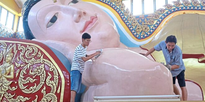 Parade of colourful floats as homage to Buddha