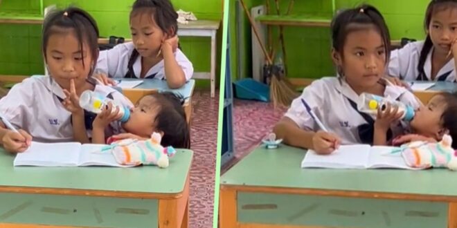 Video of Thailand girl 10 taking notes while feeding baby