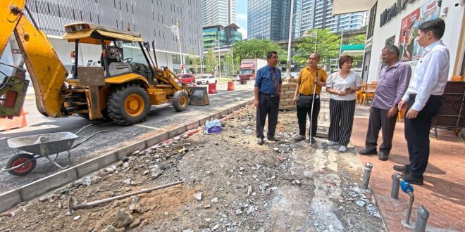 DBKL replacing broken tactile tiles in Brickfields