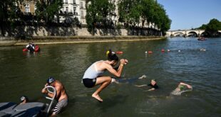 French President Macron to swim in Seine — just not