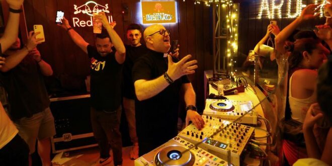 Portuguese DJ priest plays upbeat tunes to spread hope