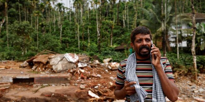 Indian soldiers building metal bridge to marooned area in Kerala