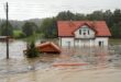 Floods kill one in Poland and rescue worker in Austria