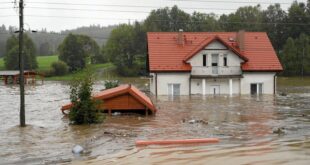 Floods kill one in Poland and rescue worker in Austria