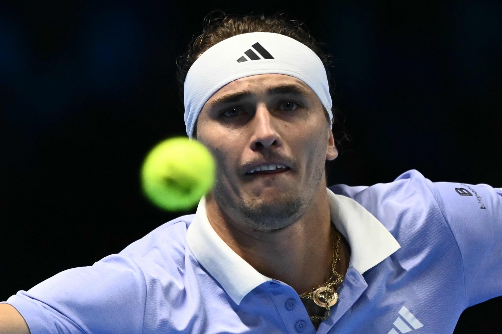 Germany's Alexander Zverev hits a return to Russia's Andrey Rublev during their match at the ATP Finals tennis tournament in Turin on November 11, 2024. — AFP pic